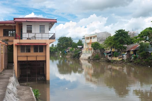 houses along the Naga river in Naga City, Philippines