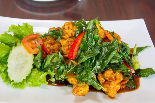 Thai Crispy Fried Chicken with Basil Leaves Bell Pepper Cucumber Tomato Dish