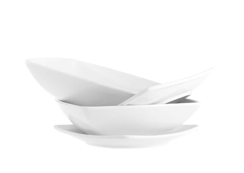 Stack of plain white dinner plates isolated on white background