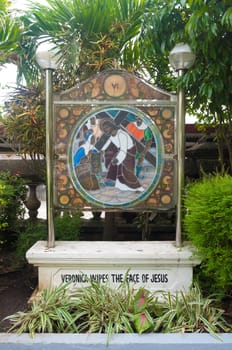 stained glass with religious text in Naga City, Philippines
