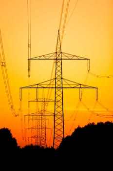 Electricity pylons at sunset