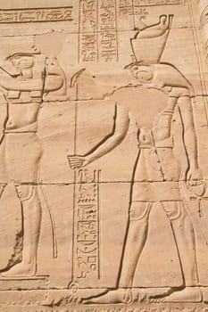 Carving of Egyptian god on pylon in Temple of Kalabsha, near Aswan (Nubia, Egypt)