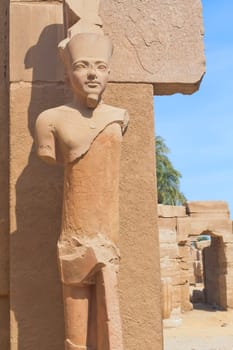 A stone statue in the Karnak temple (Luxor, Egypt). Vertically.