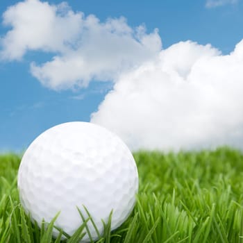Golf Ball in Grass and Blue Sky