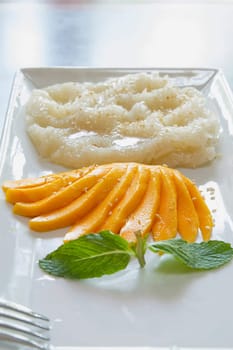 Thai Sweet Mango with Sticky Rice and Coconut Sauce Dessert Vertical