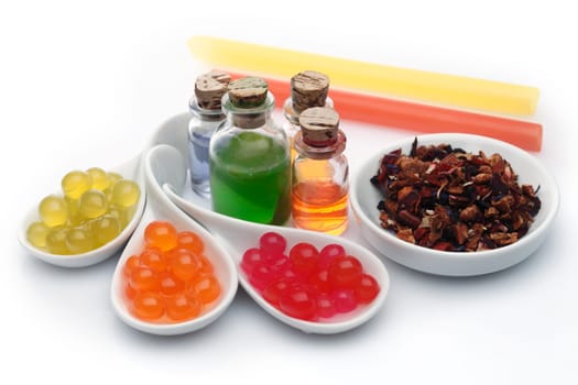 Boba bubble tea ingredients arrangement with assorted syrup and pearls