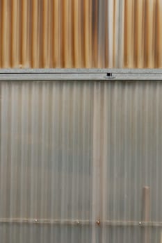 Aluminum and corrugated plastic background. Greenhouse construction detail.