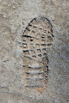 Shoe footprint on concrete surface abstract background.