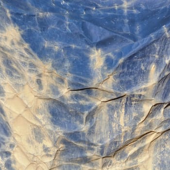 Dirty creased canvas construction debris netting background texture.