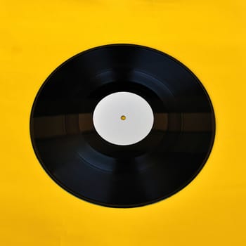 Vinyl record white label promo on yellow background. Music and audio.