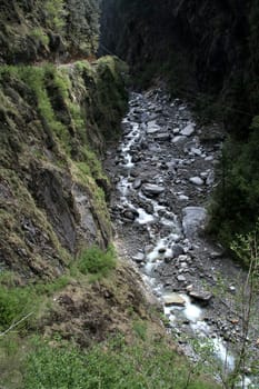 Thin current of water at the source in Yamuna River valley, India, Asia