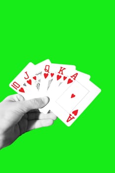 a hand with a royal flush of hearts with clipping path
