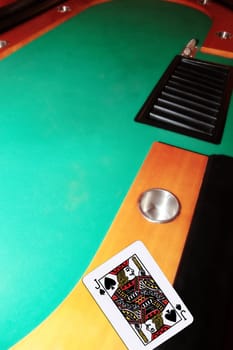 green casino table with copy space and the jack of spades representing a blackjack game