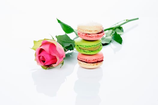 beautiful rose and assortment of macarons