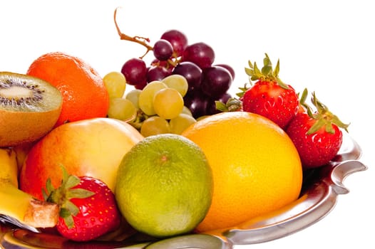 Composition of fresh fruit on the decorative metal tray.