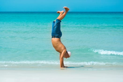 The man have a fun time on the tropical beach