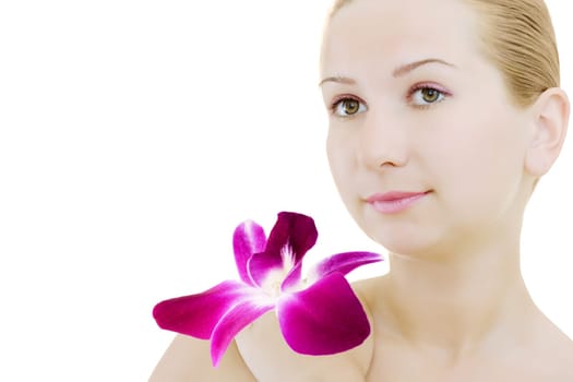 Close-up face of young woman with orchid on white background