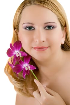 Close-up face of young woman with orchid on white background