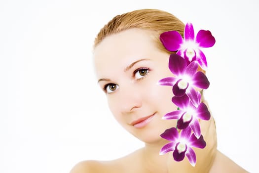 Close-up face of young woman with orchid