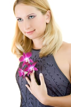 Portrait of a beautiful young woman with orcgid on white background
