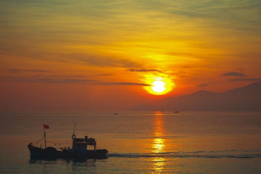Vietnamese fisherman boat at sunrise time