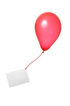 Red balloon with a greeting card on a ribbon