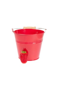 Red tin bucket with a strawberry