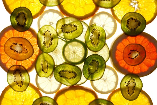 Colorful background of different fruit slices