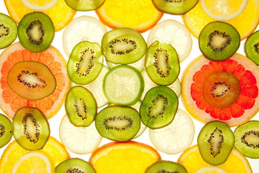 Colorful background of different fruit slices