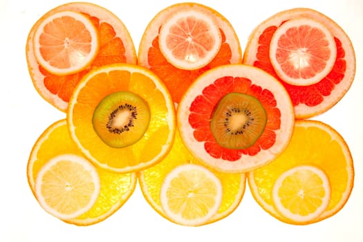 Colorful background of different fruit slices