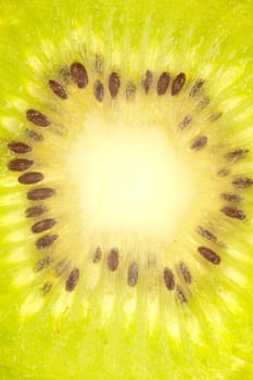 Macro shot of the middle section of a kiwi slice