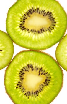 Background of two whole and two quarter kiwi slices