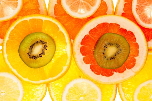 Colorful background of different fruit slices