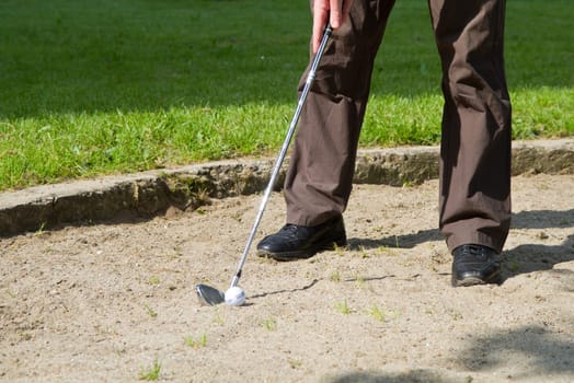 golf ball in a bunker