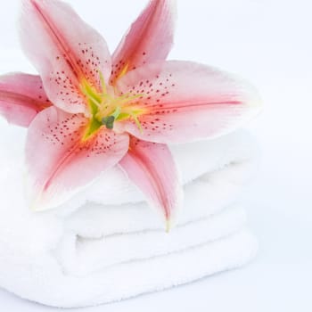 White towel and lily flower. Spa concept