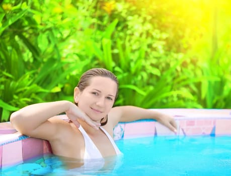 Young woman relaxing in Jacuzzi outdoor