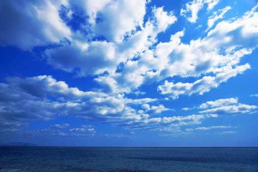 Cloudy sky and blue sea. Seascape background