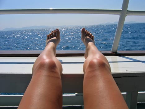 bare feet of the women and sea