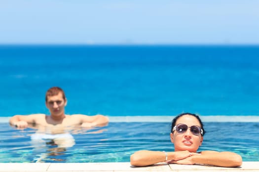 Young couple in swimming pool