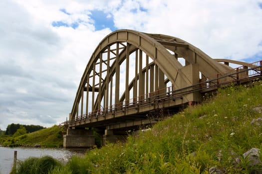 old stone railway bridge on the river