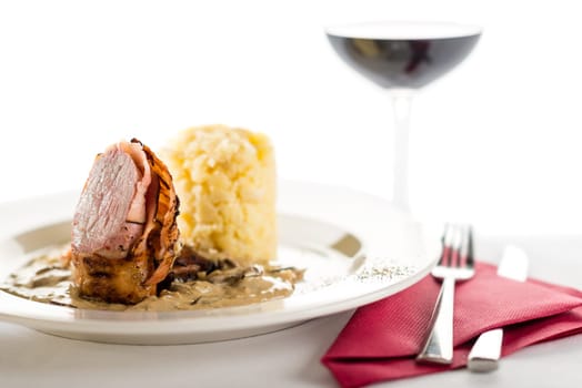 Delicious sirloin steak with mushroom and mashed potatoes and red wine