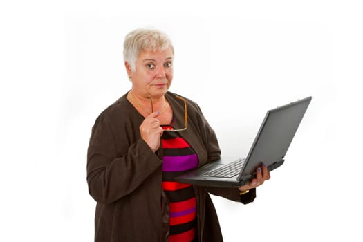 Senior woman using laptop - isolated on white background