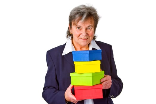 Senior woman with colorful gifts - isolated on white background