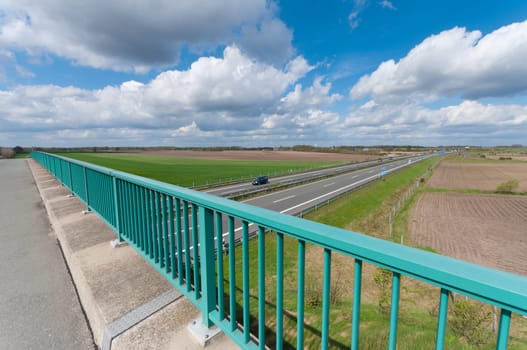 view over an autobahn somewhere in germany under a nice cloudy sky