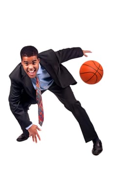 Businessman playing basket isolated in white