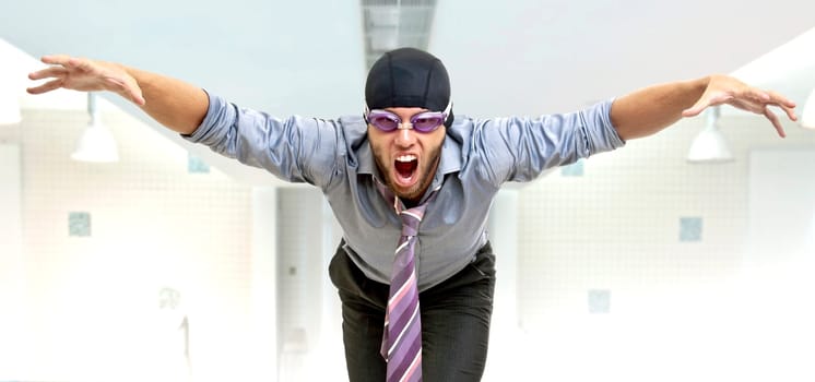 Businessman with swimming gear in a pool