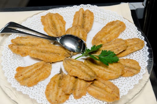 breaded and fried anchovies with parsley
