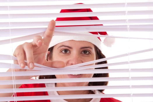 Mrs. Santa Claus hands apart on the window blinds