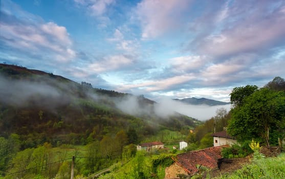View from the top of a mountain during sunrise in Asturias, Spain.