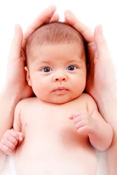 baby protected by mother&#039 s hands